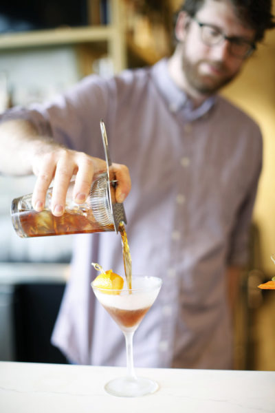 Floret SeaTac Restaurant- Bartender Pours Craft Cocktail